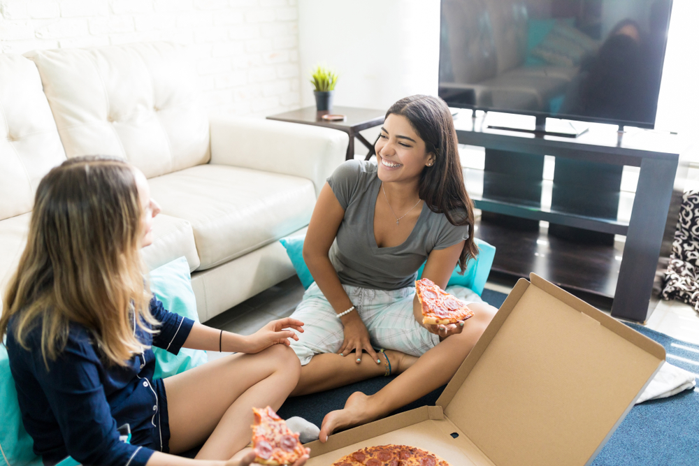 Young females having pizza